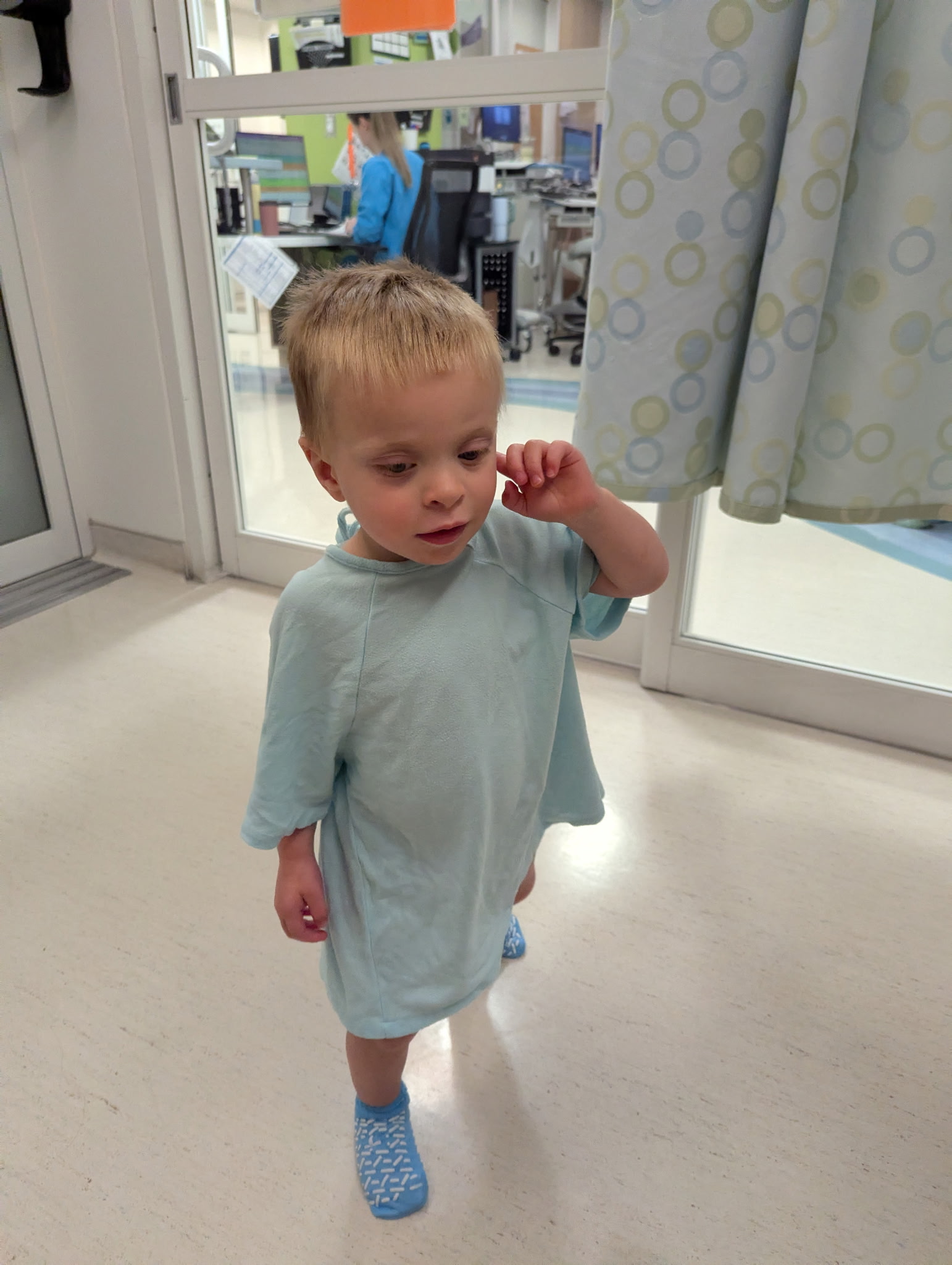 Micaiah getting gowned up at Seattle Children's